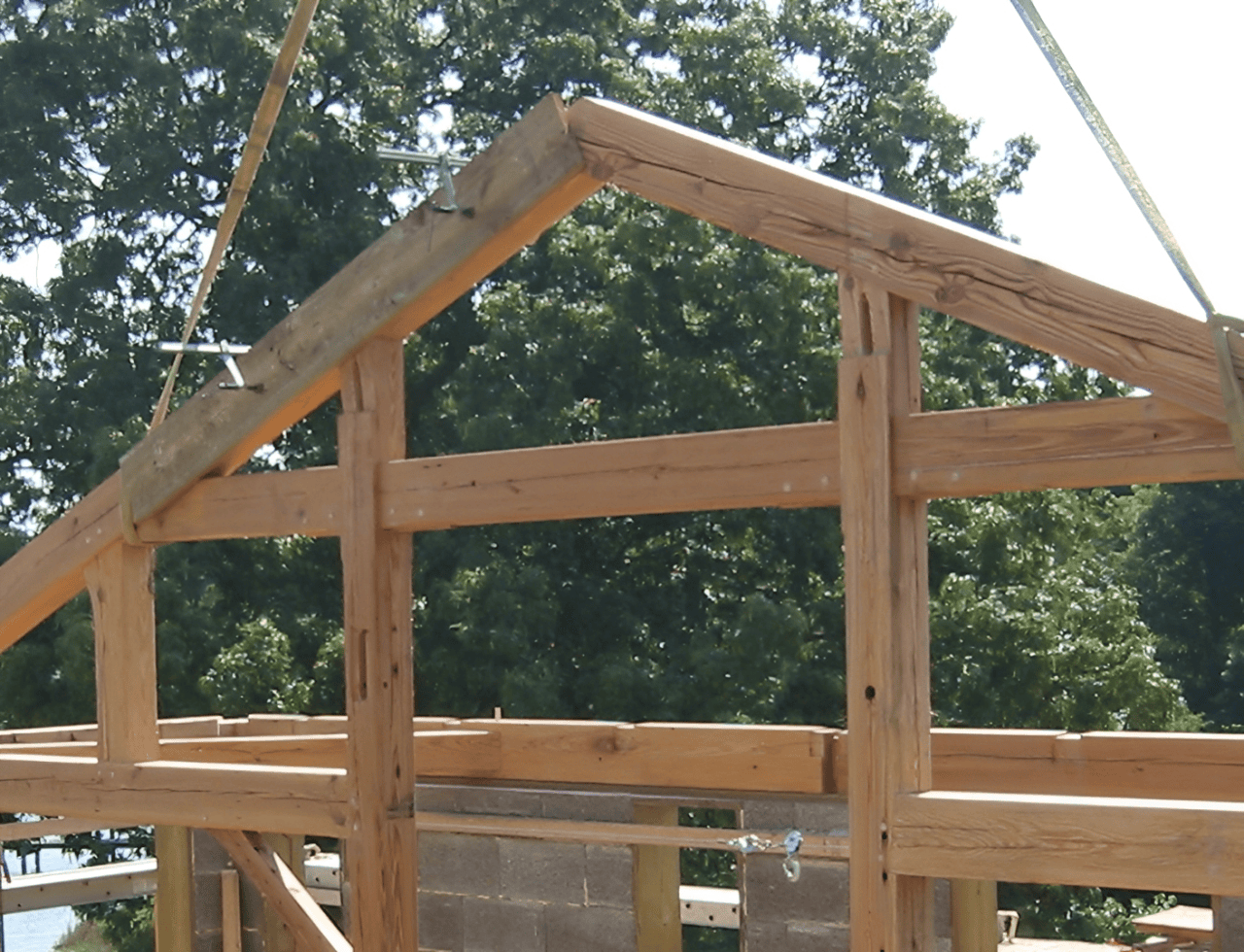 Timber structure with trees in background